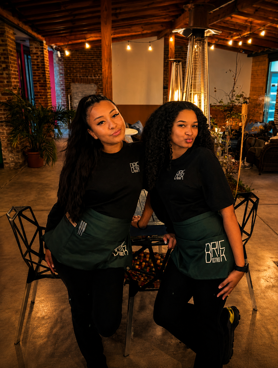 Brick Bistro servers known as the Brick Angels standing together in the courtyard