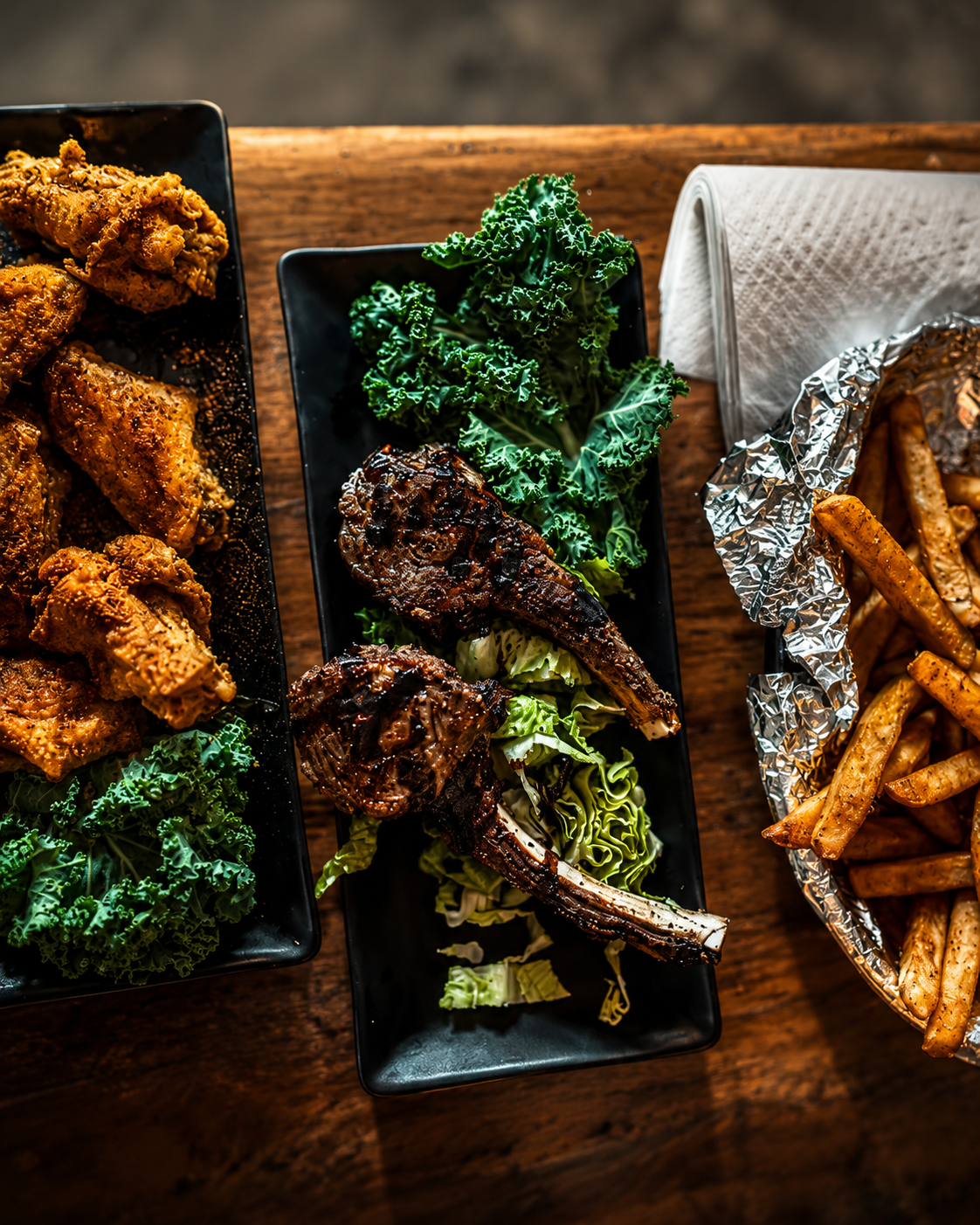Brick Bistro platter with lamb chops, wings, and seasoned fries